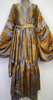 A gray satin kimono-style robe with a gold floral pattern, displayed on a dress form against a plain white background.